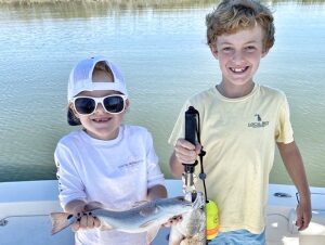 children fishing caught one